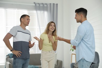 Photo of Group of people talking in living room