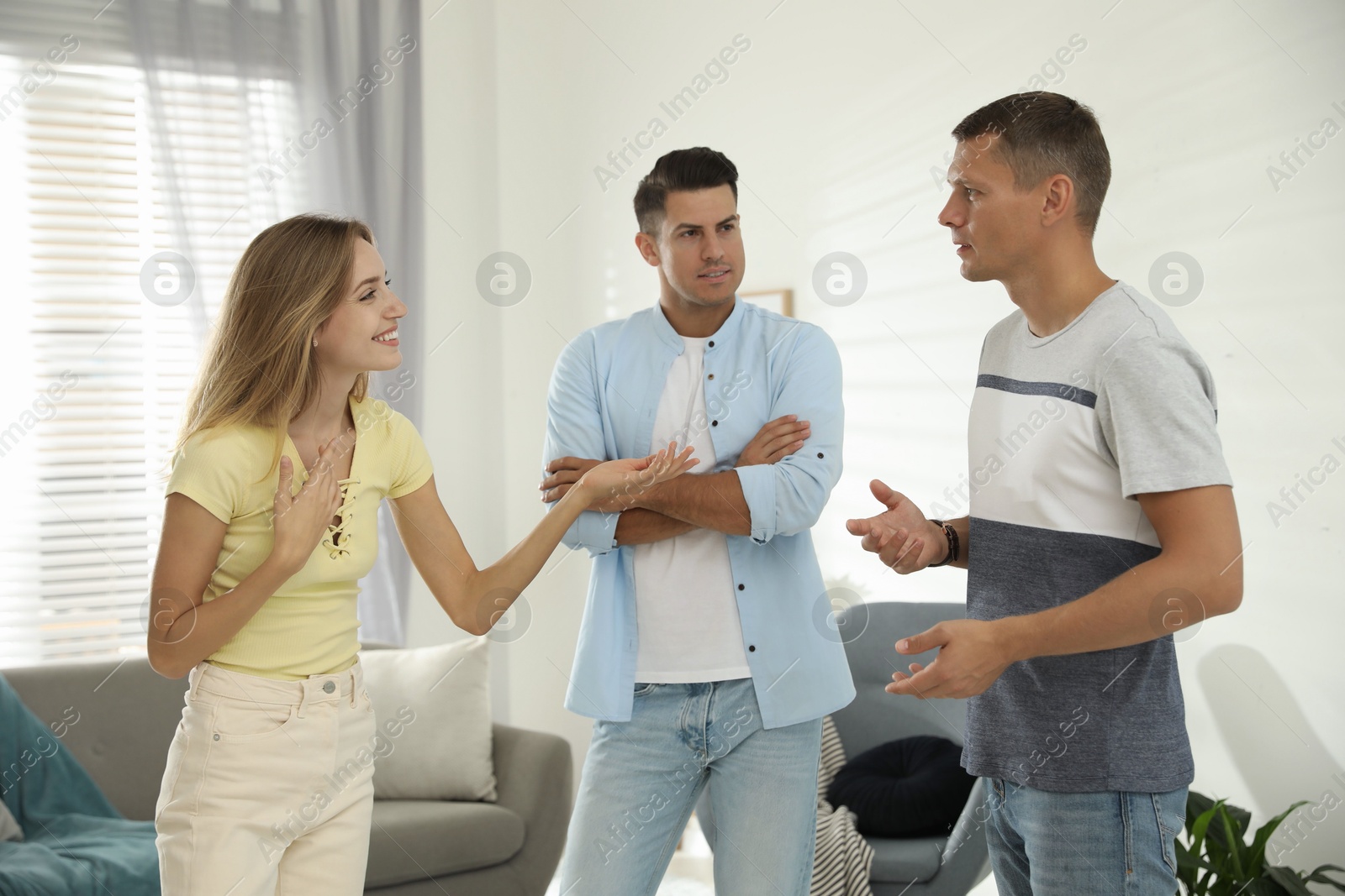 Photo of Group of people talking in living room