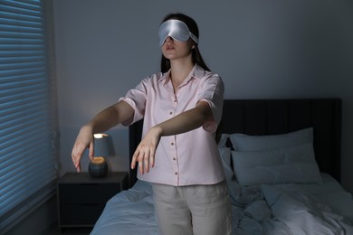 Photo of Young woman suffering from sleepwalking at home