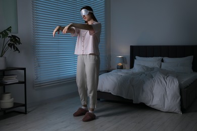 Photo of Young woman suffering from sleepwalking at home