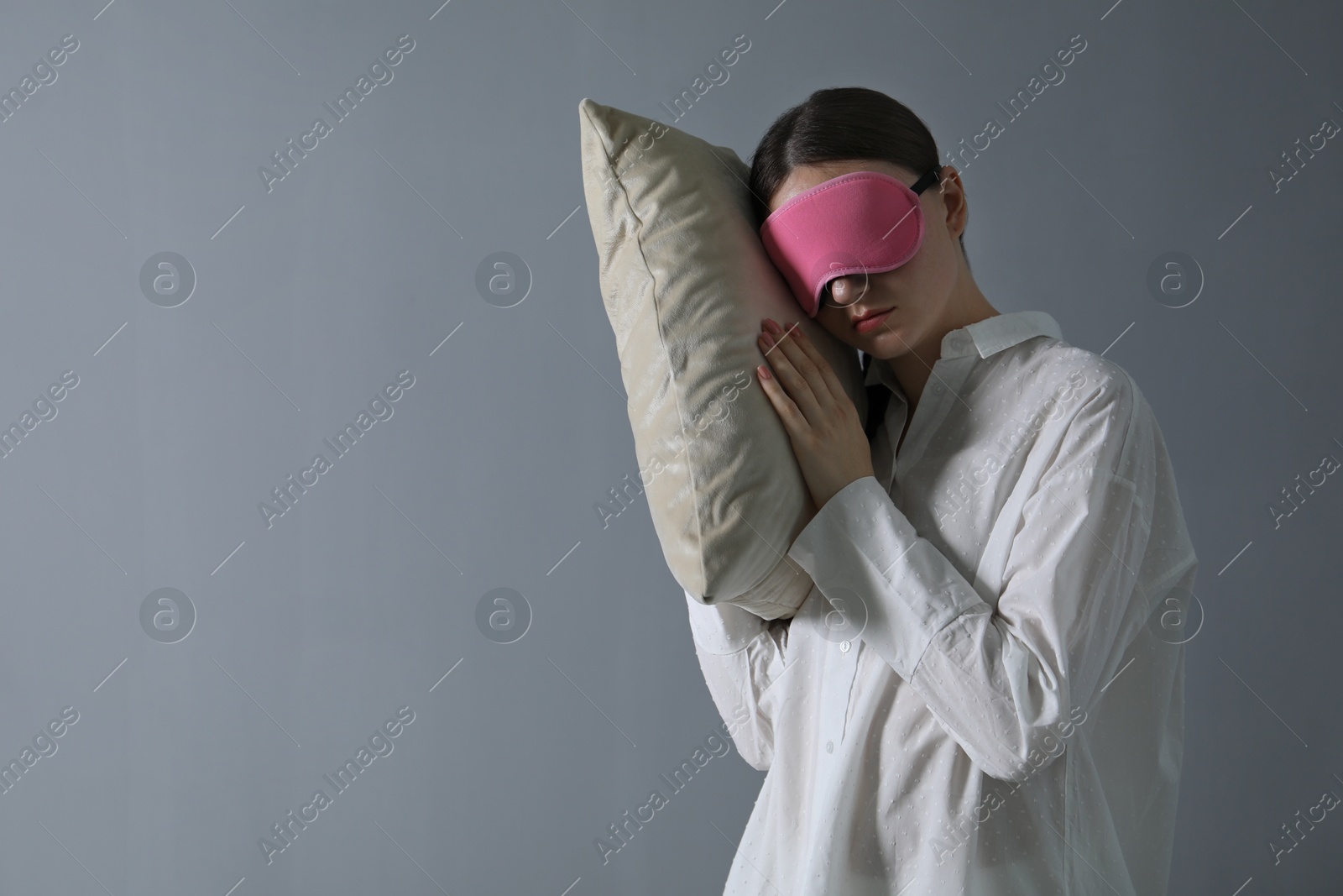 Photo of Young woman suffering from sleepwalking at home, space for text