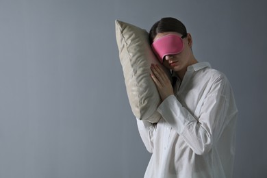 Photo of Young woman suffering from sleepwalking at home, space for text