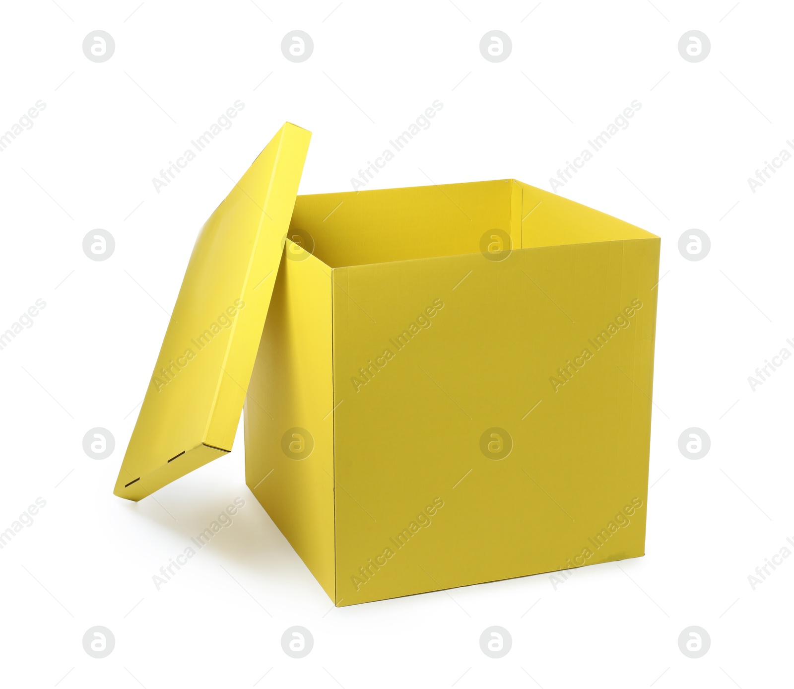 Photo of Yellow gift box with cap isolated on white