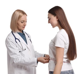 Weight loss. Nutritionist measuring patient's waist with tape on white background