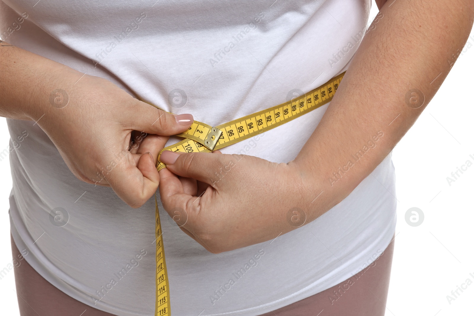 Photo of Weight loss. Plus size woman measuring waist with tape on white background, closeup