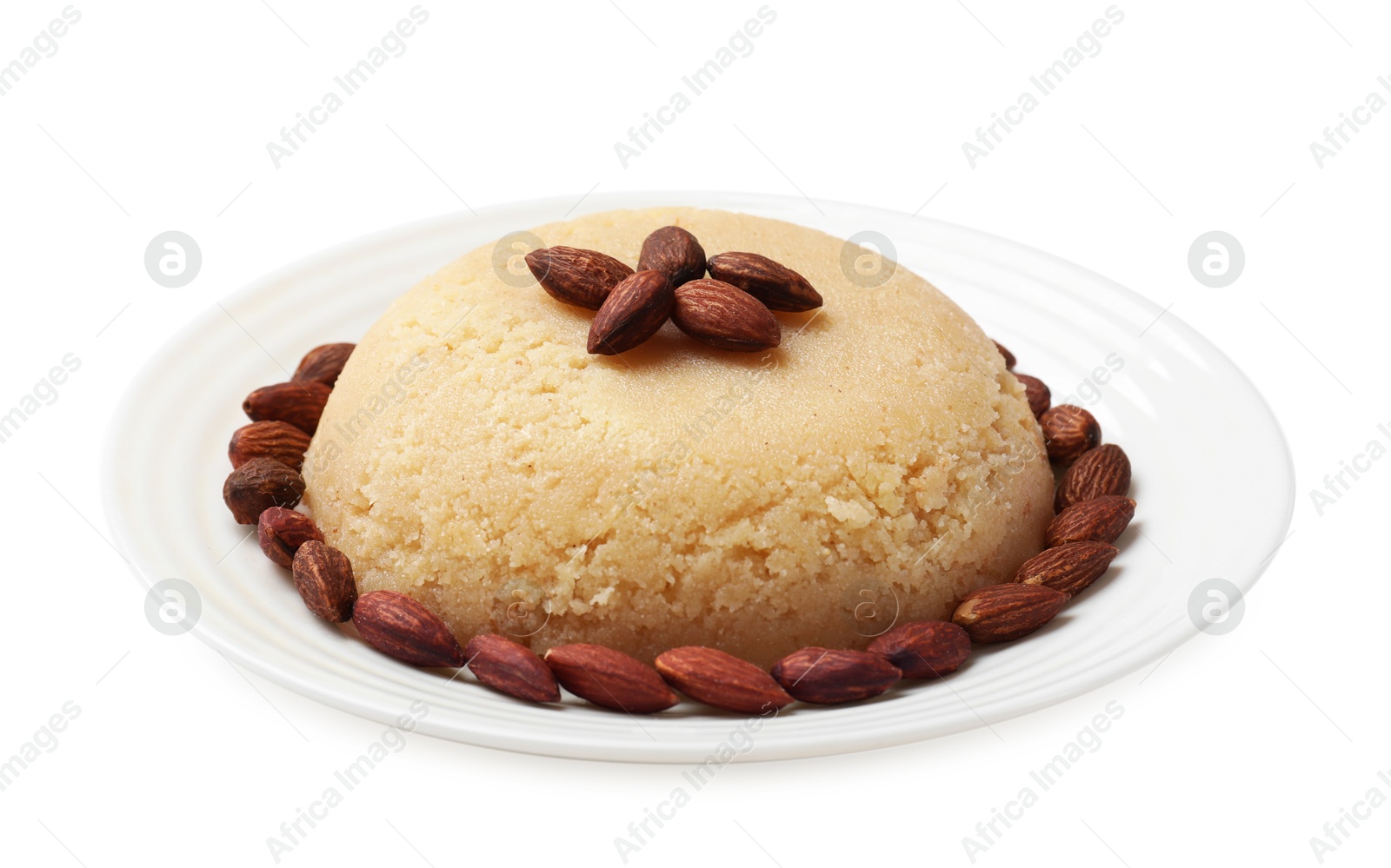 Photo of Delicious semolina halva with almonds isolated on white