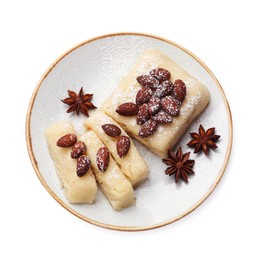 Photo of Delicious sweet semolina halva with almonds and spices isolated on white, top view