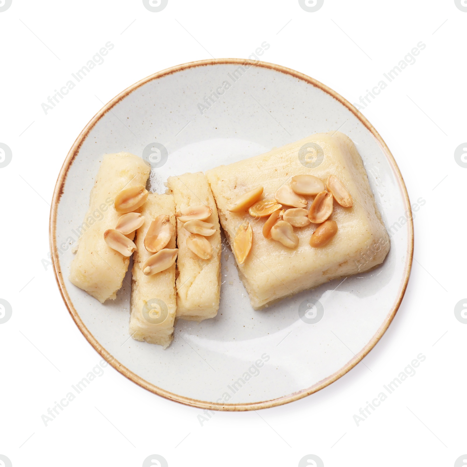 Photo of Delicious sweet semolina halva with peanuts isolated on white, top view