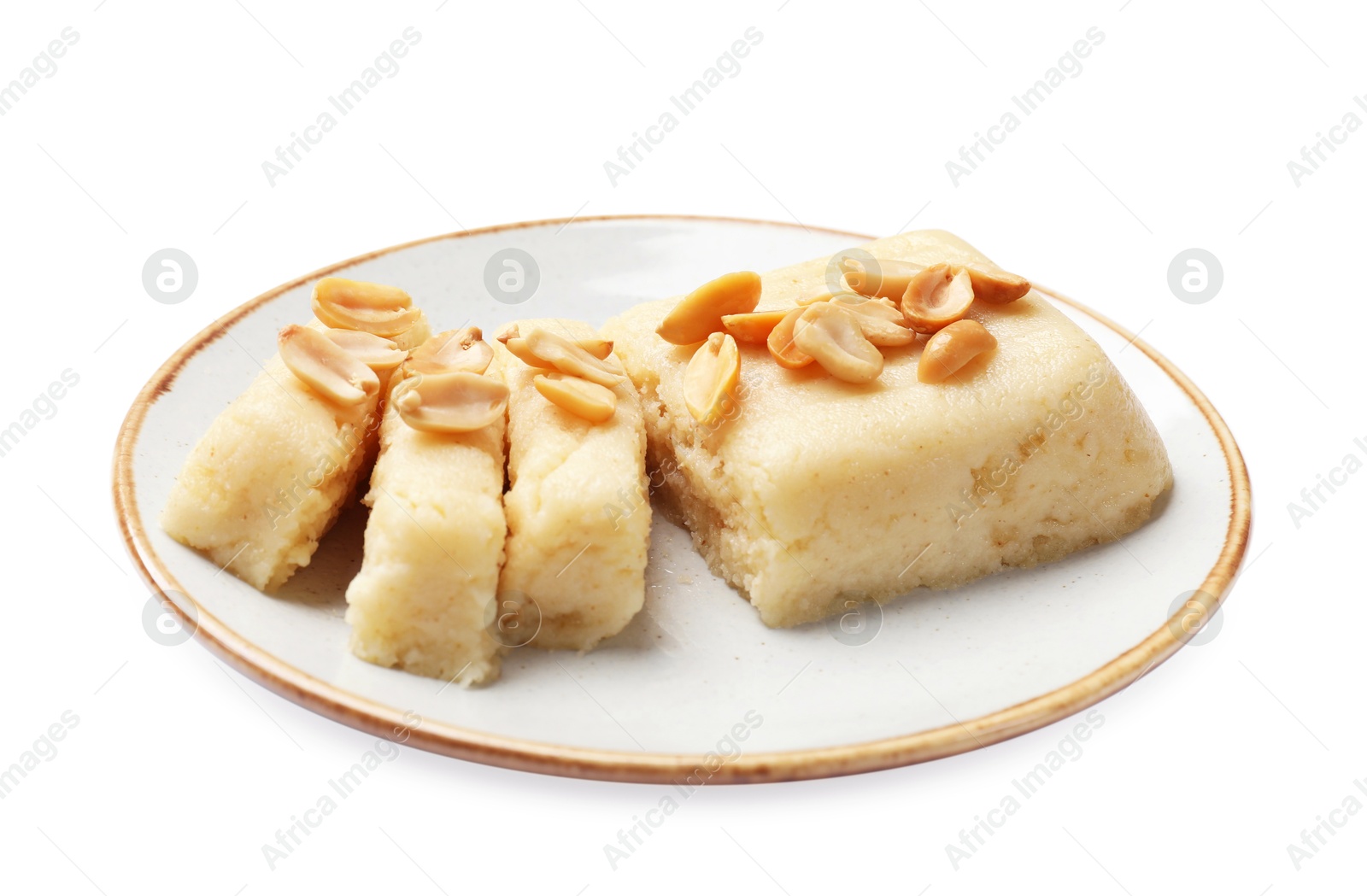 Photo of Delicious sweet semolina halva with peanuts isolated on white