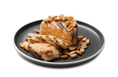 Photo of Delicious sweet semolina halva with peanuts isolated on white