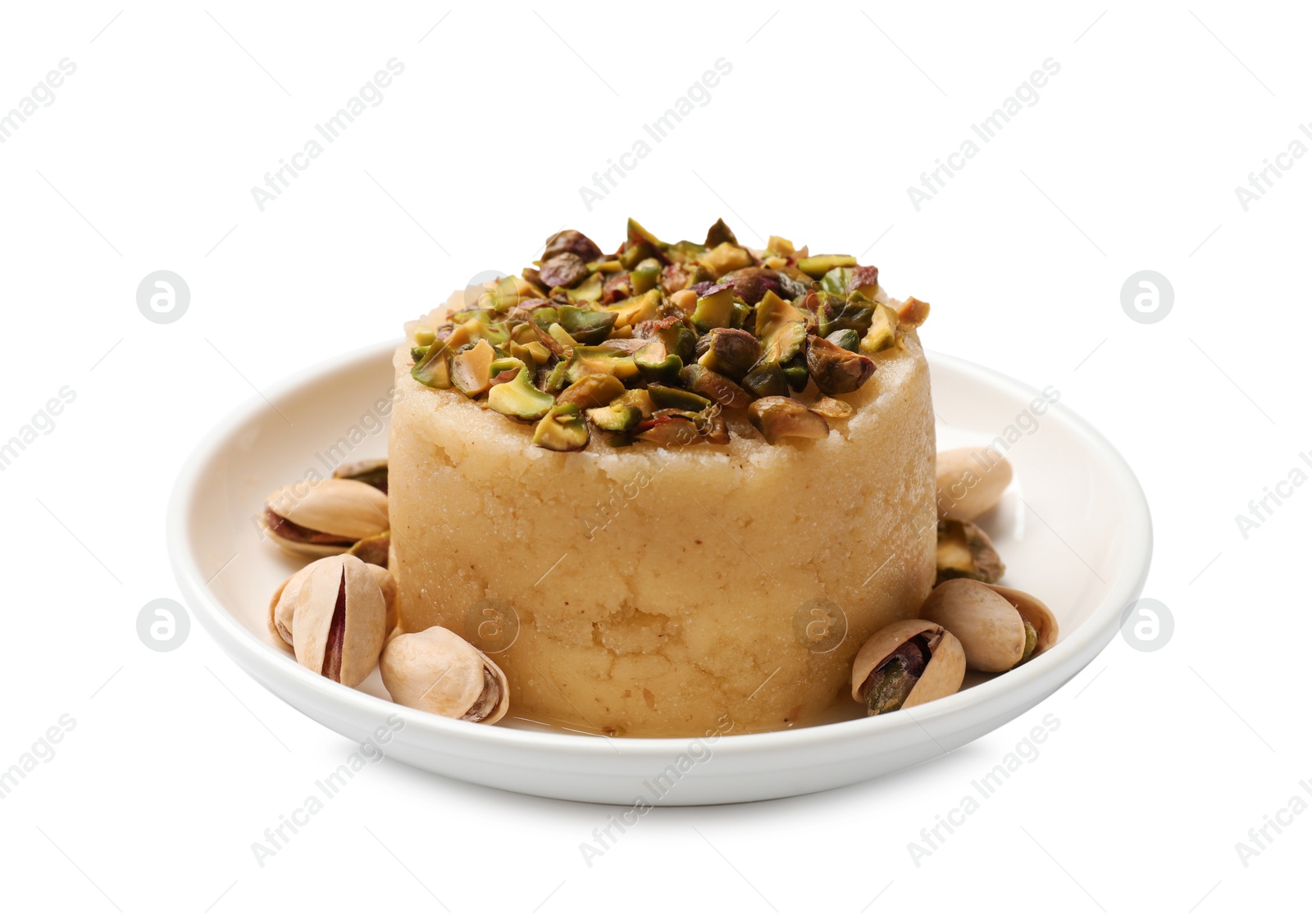 Photo of Delicious sweet semolina halva with pistachios isolated on white