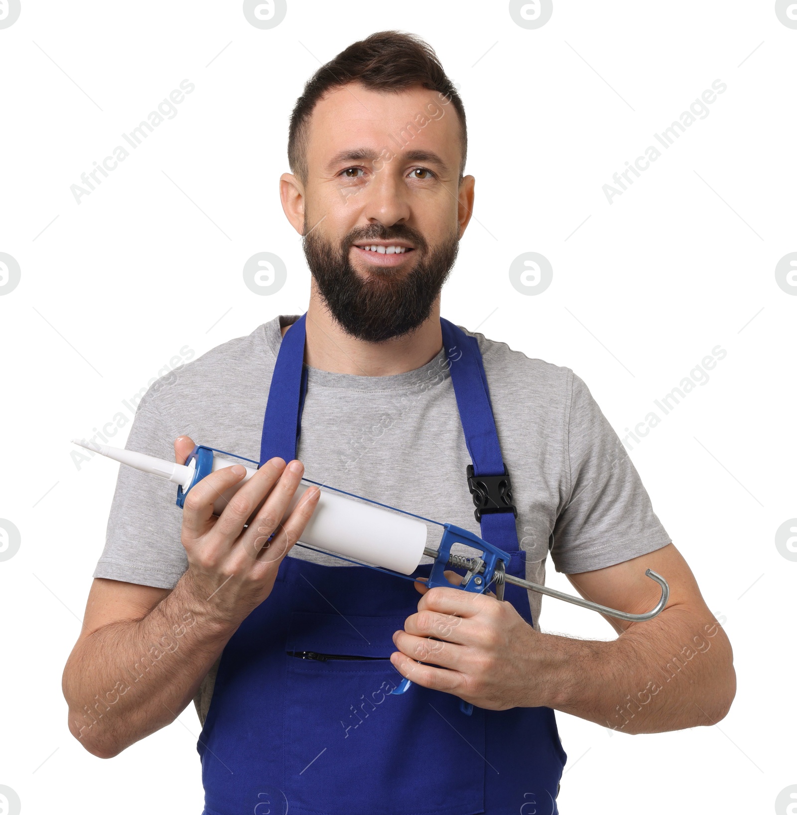 Photo of Worker with caulking gun on white background