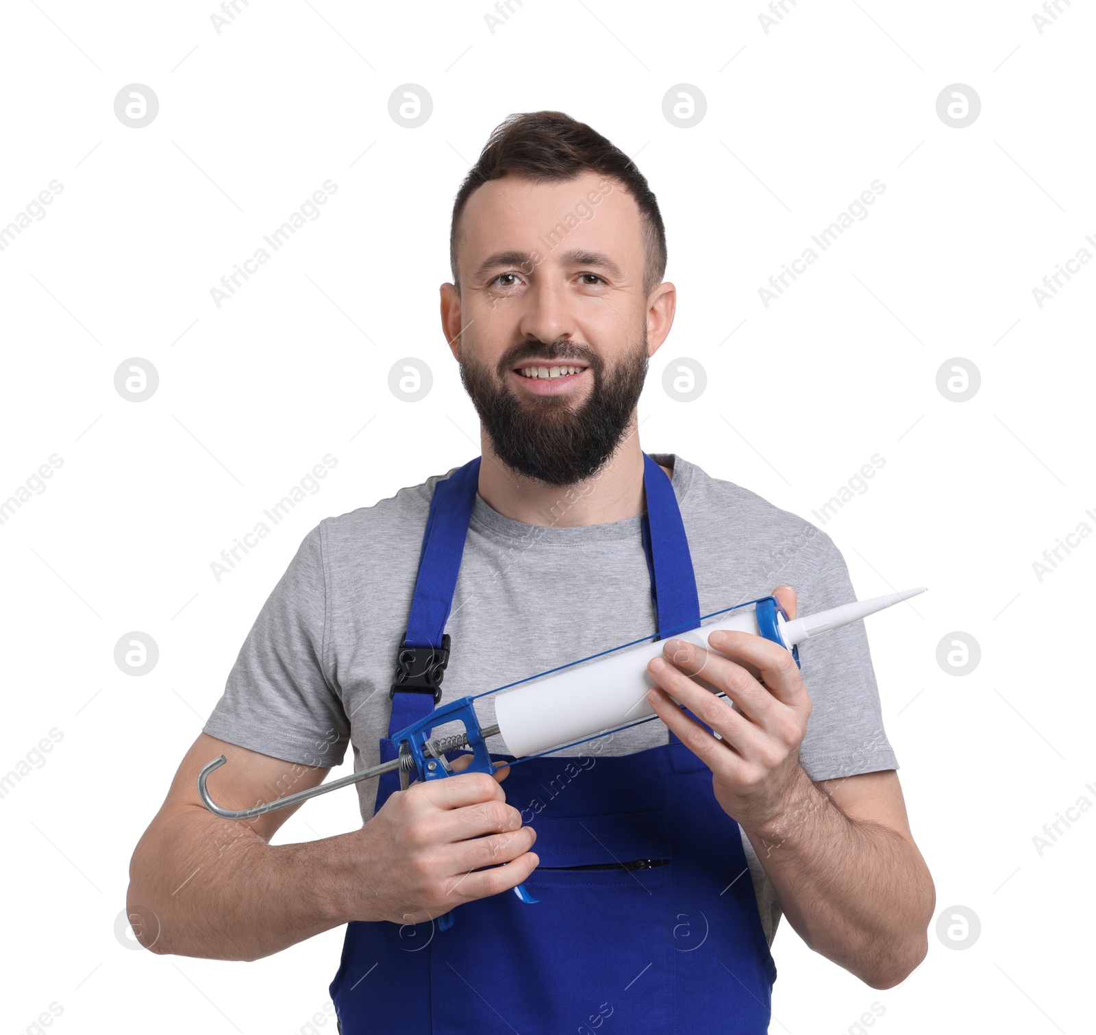 Photo of Worker with caulking gun on white background