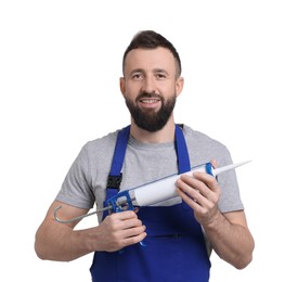 Worker with caulking gun on white background