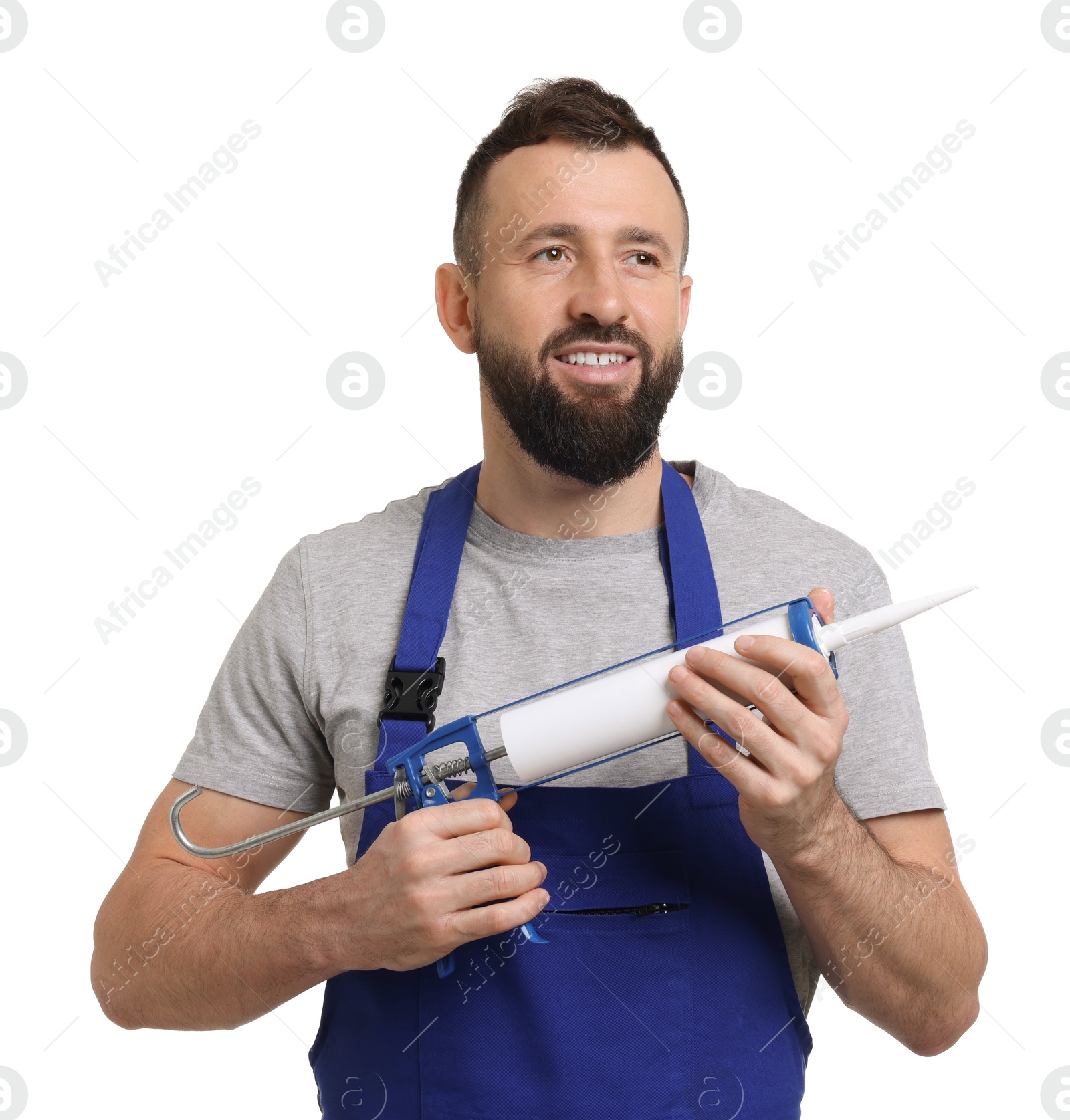 Photo of Worker with caulking gun on white background