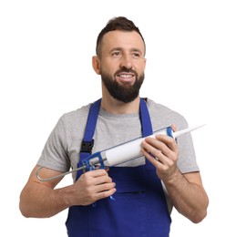 Worker with caulking gun on white background