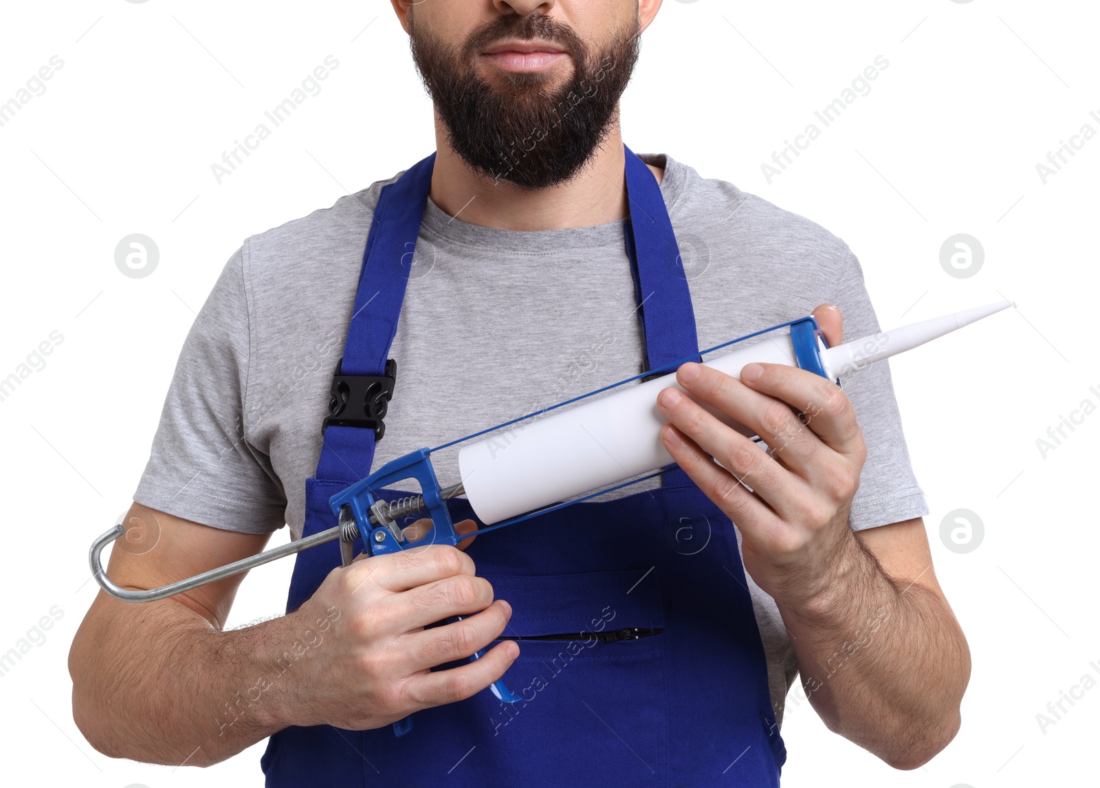 Photo of Worker with caulking gun on white background, closeup