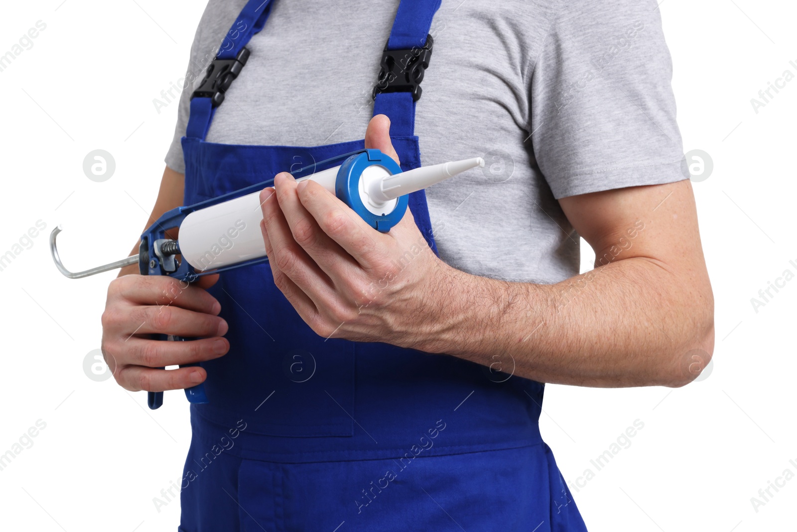 Photo of Worker with caulking gun on white background, closeup