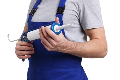 Photo of Worker with caulking gun on white background, closeup