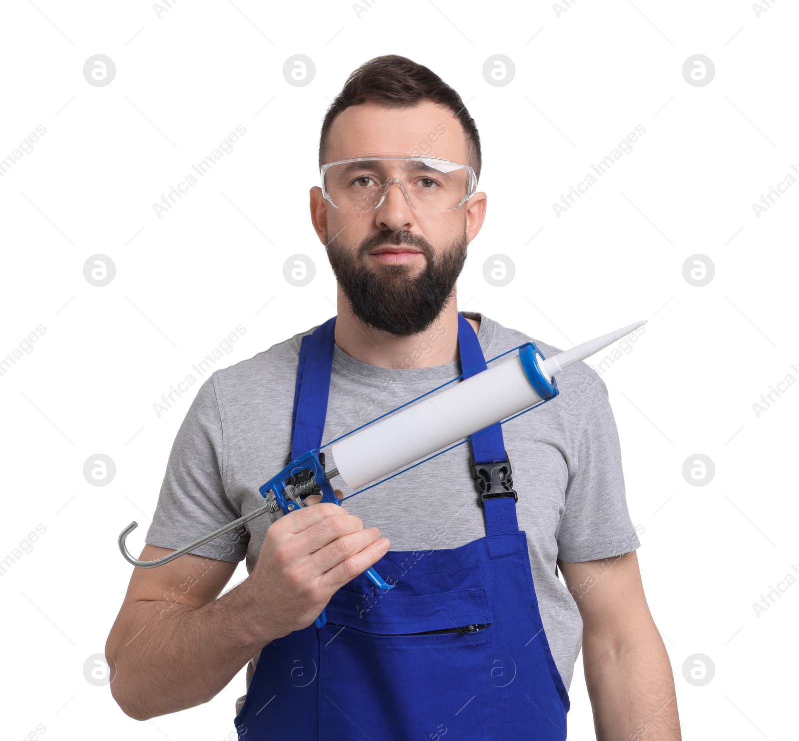 Photo of Worker with caulking gun on white background