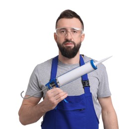 Worker with caulking gun on white background