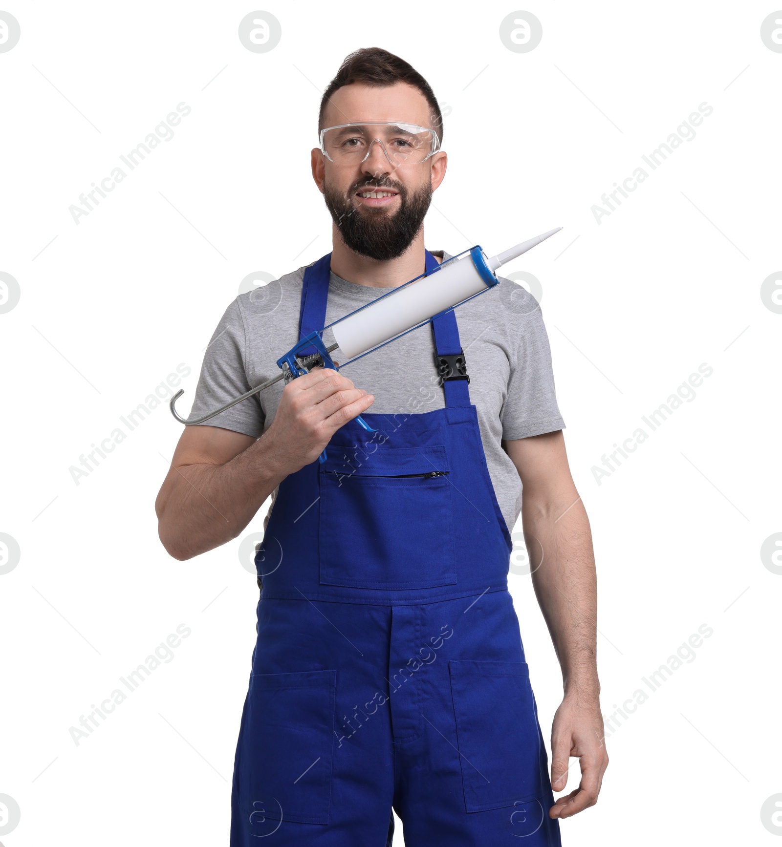 Photo of Worker with caulking gun on white background