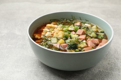 Photo of Delicious okroshka soup with kvass on light table