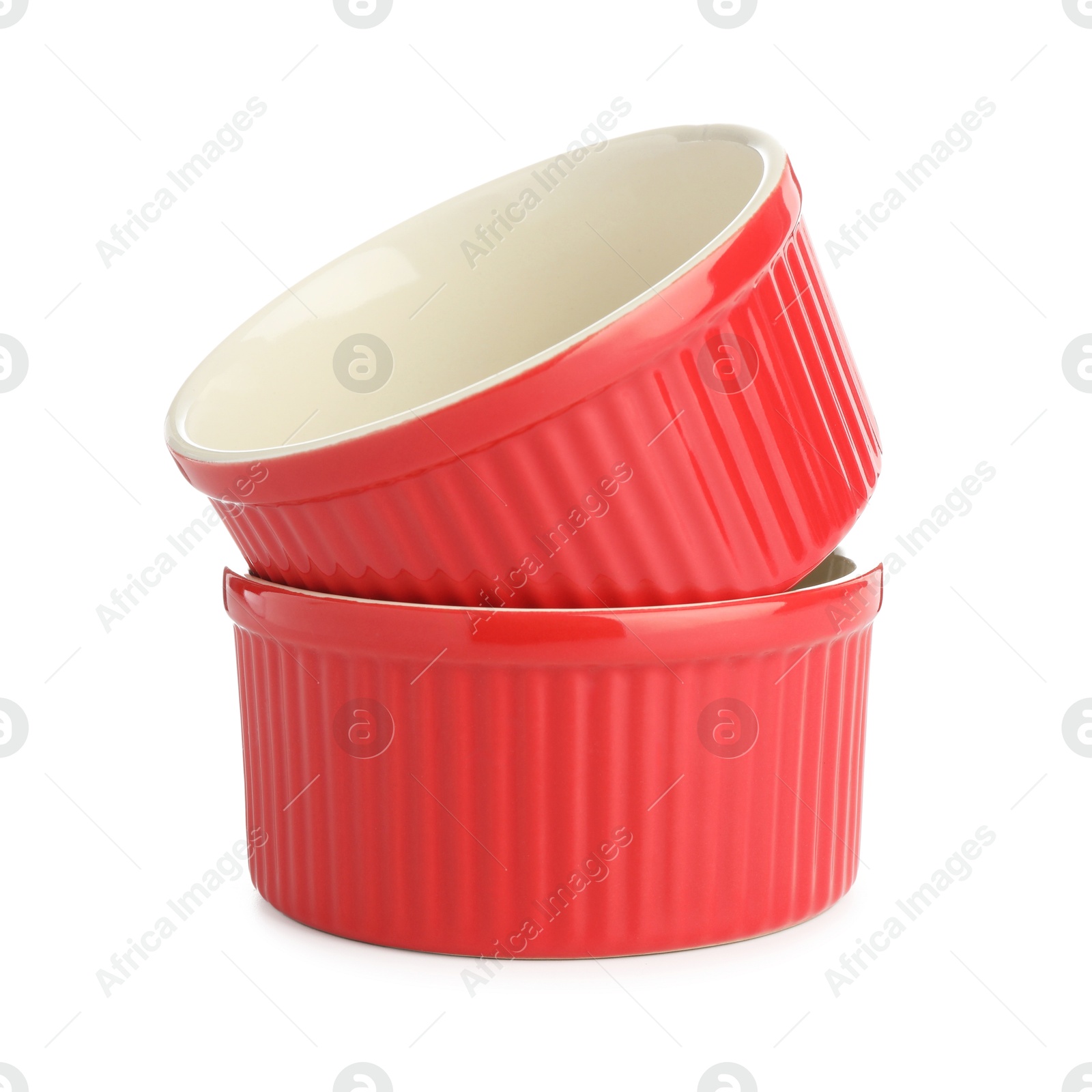 Photo of Two red casseroles isolated on white. Cooking utensil