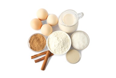 Photo of Making cinnamon rolls. Different ingredients for dough isolated on white, top view