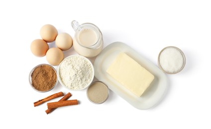 Photo of Making cinnamon rolls. Different ingredients for dough isolated on white, top view