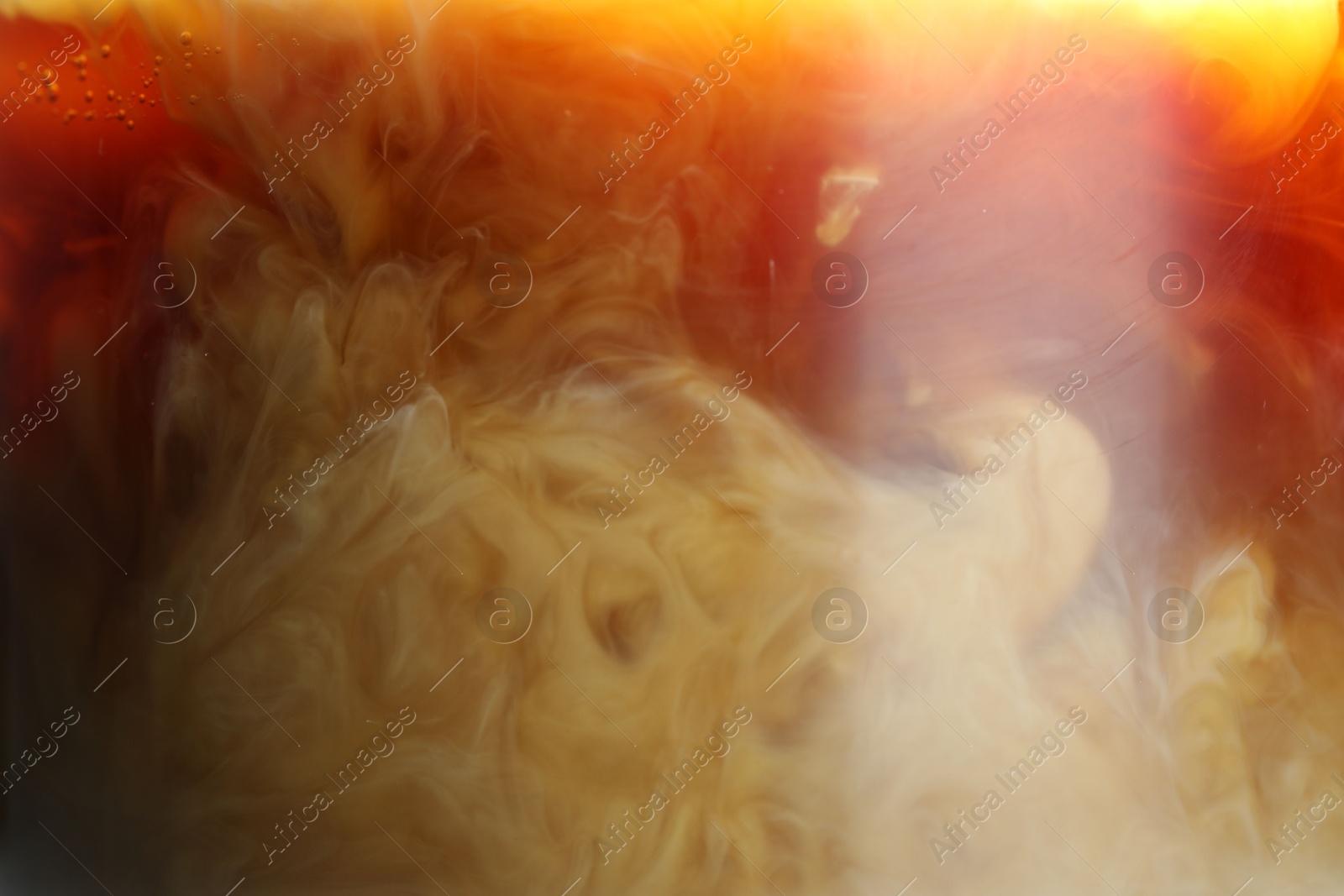 Photo of Refreshing coffee with ice and milk as background, closeup