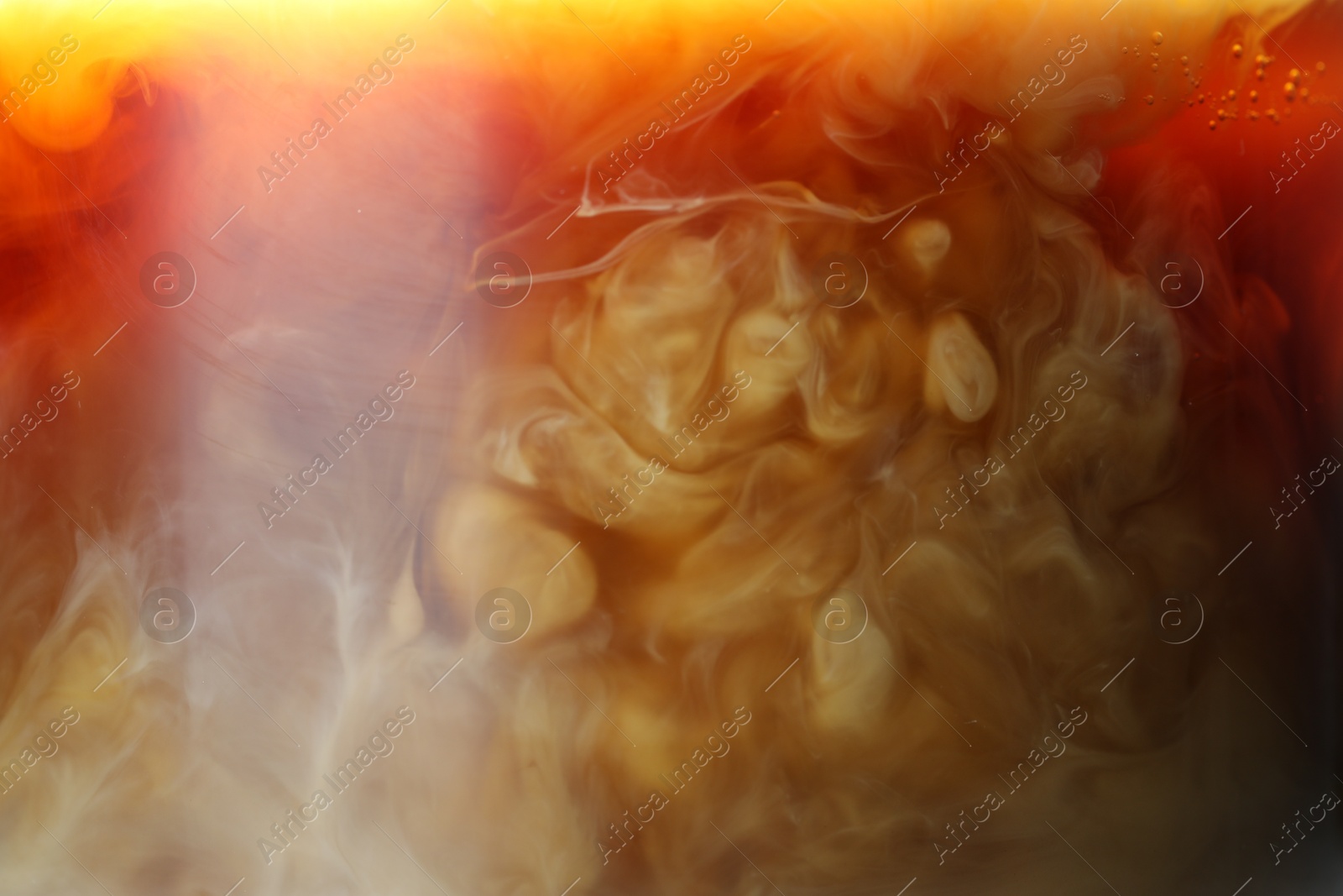 Photo of Refreshing coffee with ice and milk as background, closeup