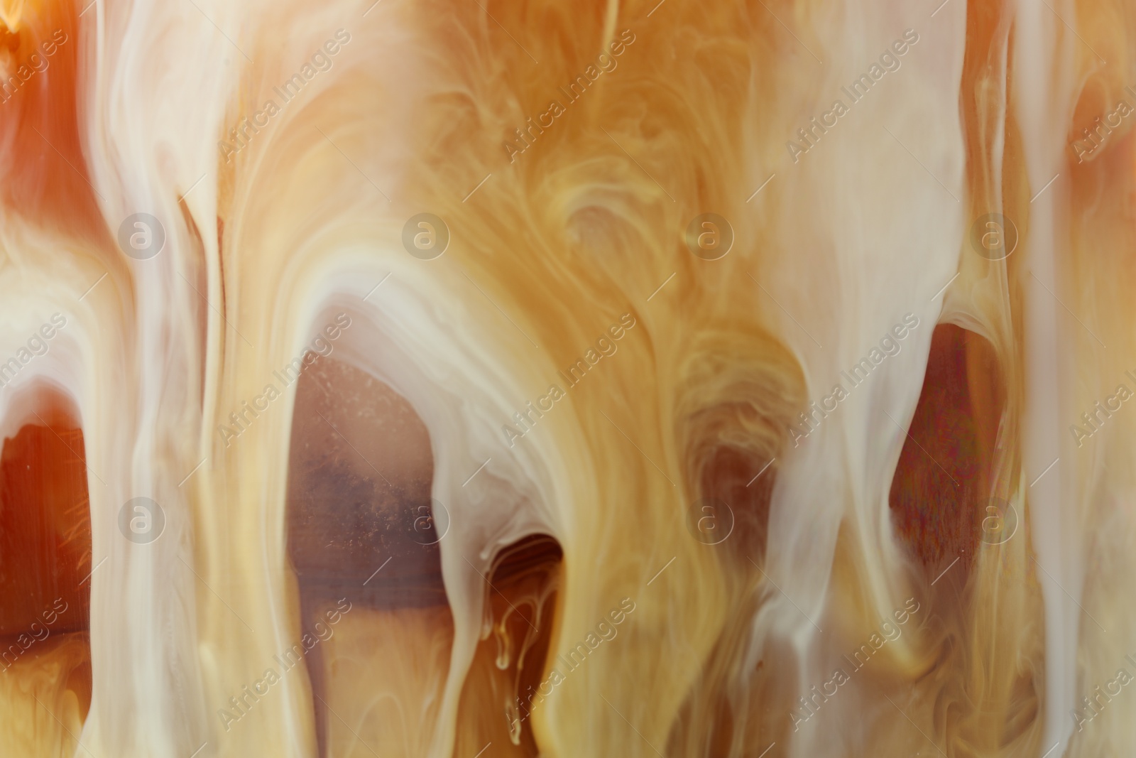 Photo of Refreshing coffee with ice and milk as background, closeup