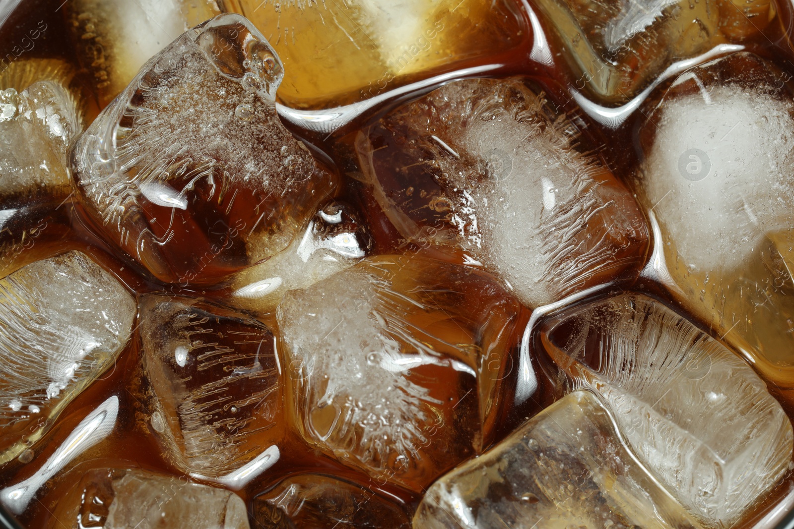 Photo of Refreshing coffee with ice cubes as background, top view