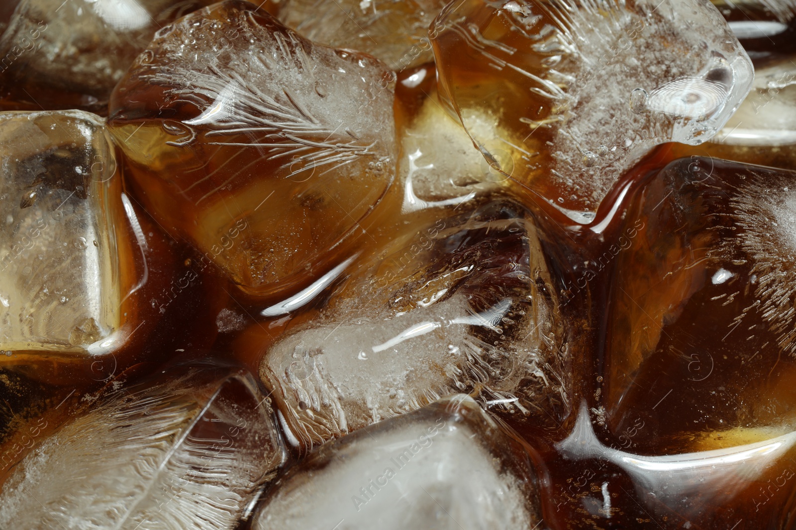 Photo of Refreshing coffee with ice cubes as background, above view