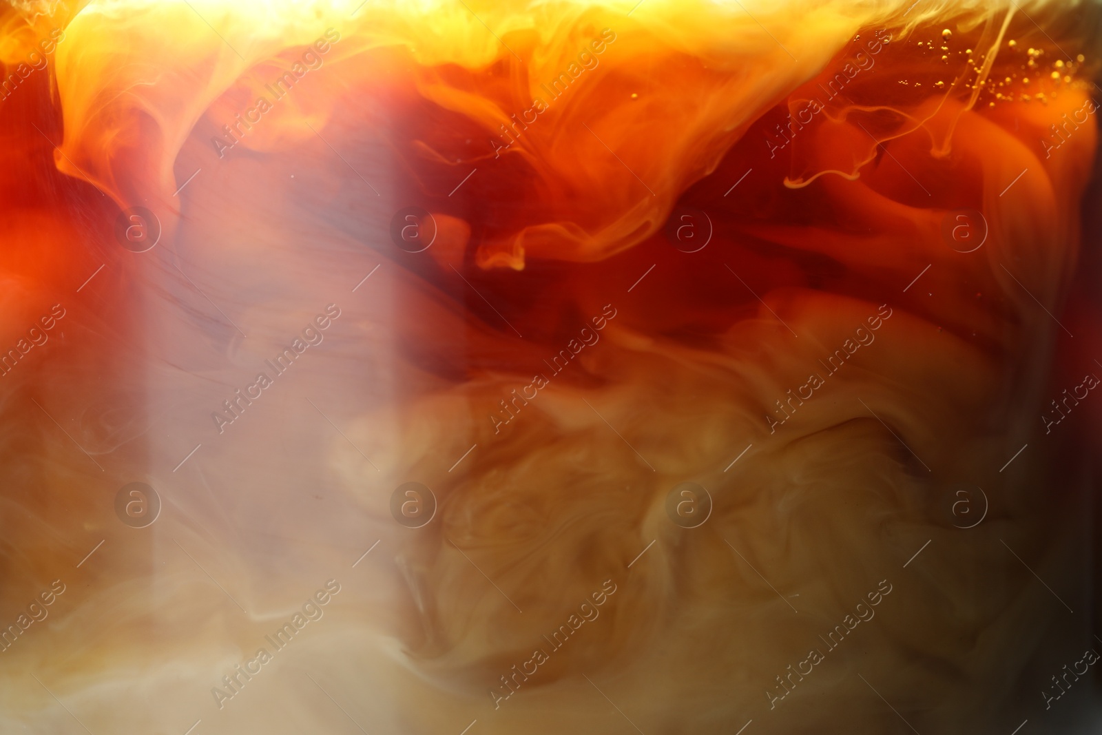 Photo of Refreshing coffee with ice and milk as background, closeup