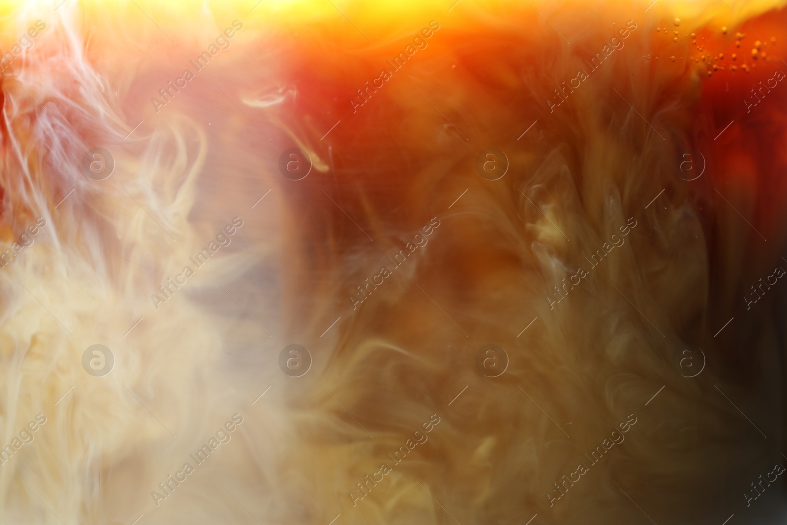 Photo of Refreshing coffee with ice and milk as background, closeup