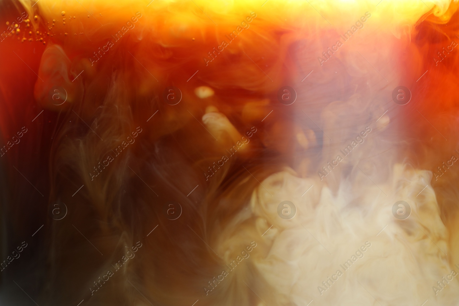 Photo of Refreshing coffee with ice and milk as background, closeup