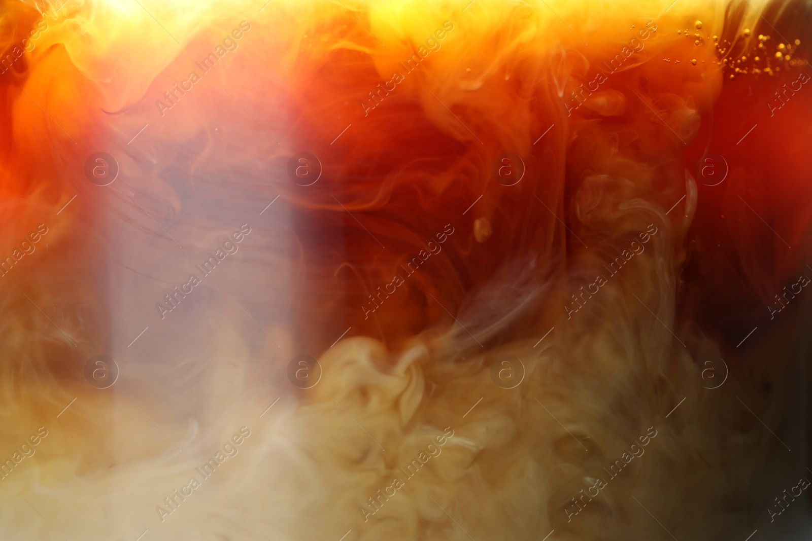 Photo of Refreshing coffee with ice and milk as background, closeup