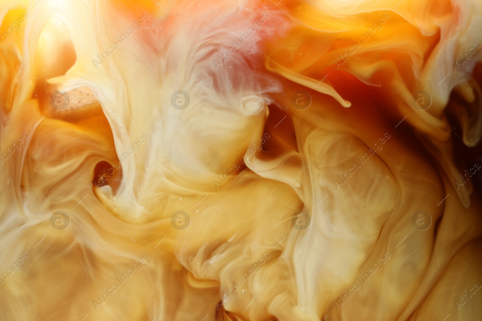 Photo of Refreshing coffee with ice and milk as background, closeup