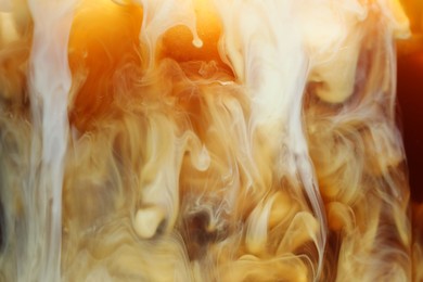 Photo of Refreshing coffee with ice and milk as background, closeup