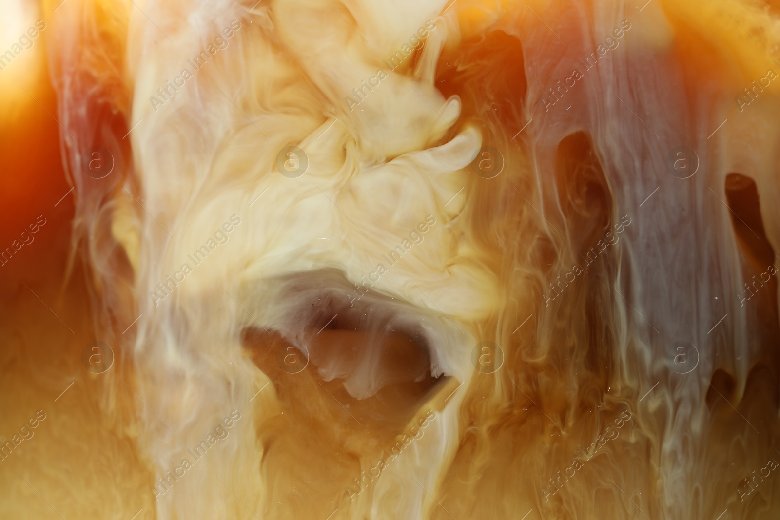 Photo of Refreshing coffee with ice and milk as background, closeup