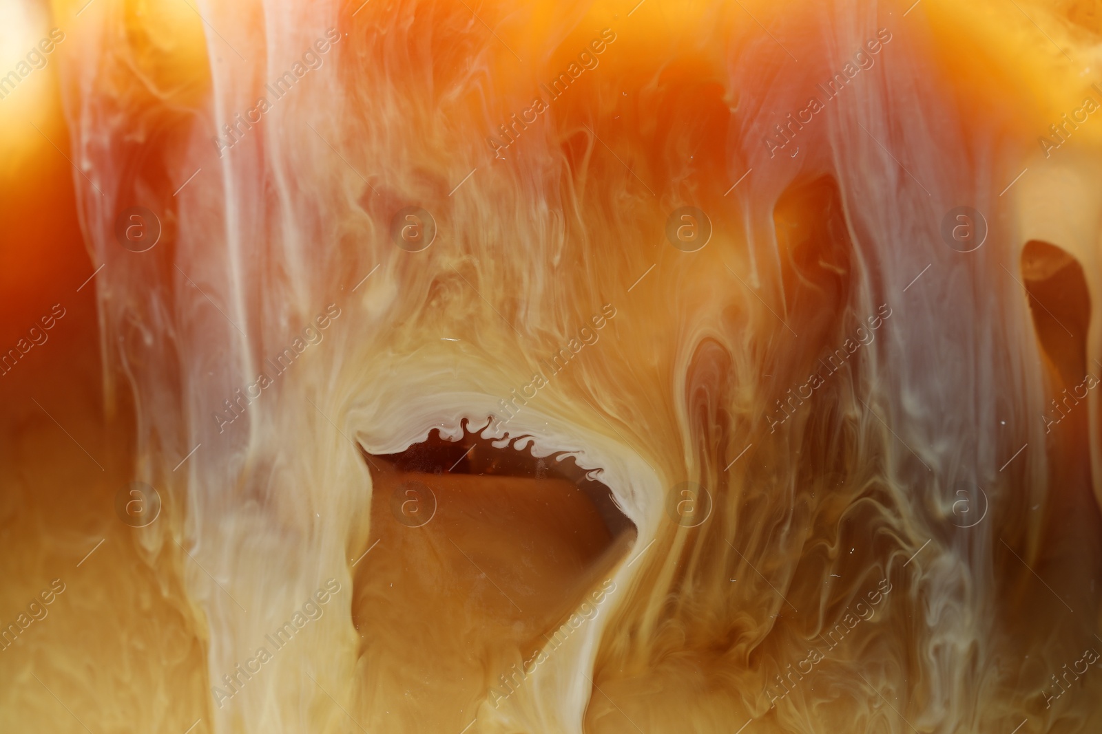 Photo of Refreshing coffee with ice and milk as background, closeup