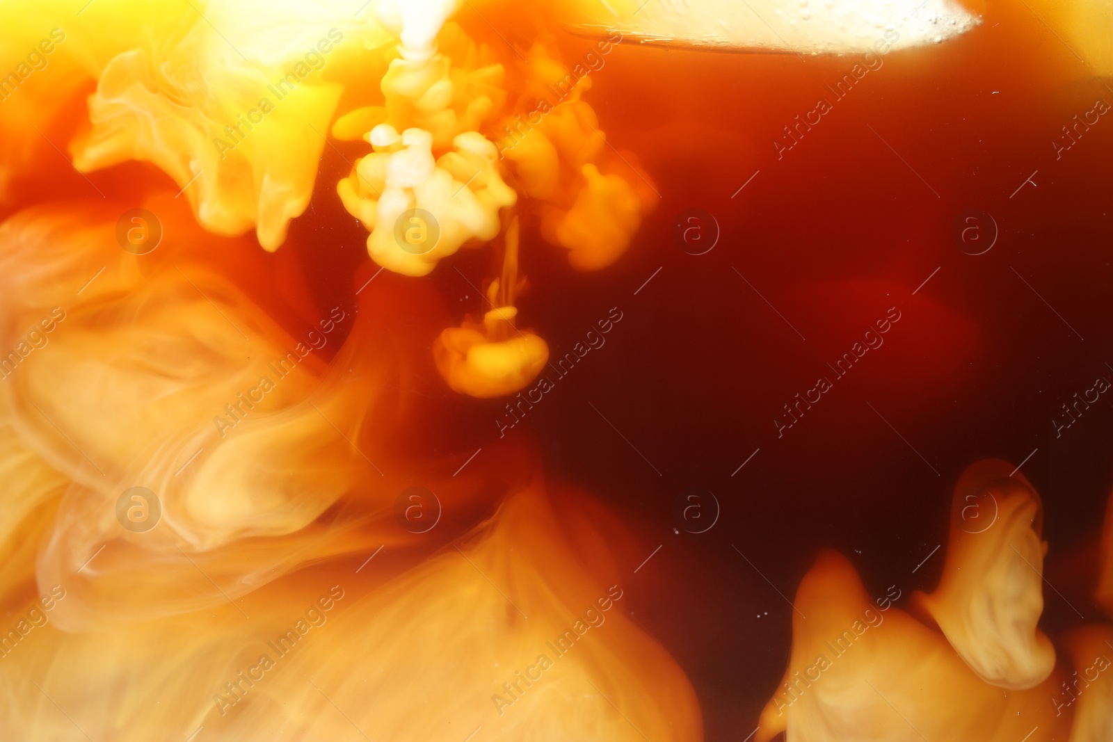 Photo of Refreshing coffee with milk as background, closeup