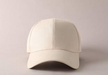 Photo of Stylish baseball cap on light grey background. Mockup for design