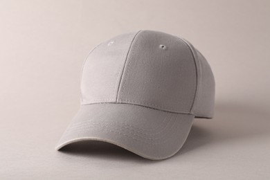 Photo of Stylish baseball cap on light grey background. Mockup for design