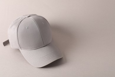 Photo of Stylish baseball cap on light grey background. Mockup for design