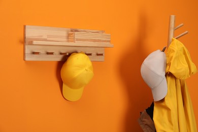 Photo of Stylish baseball caps indoors. Mockup for design