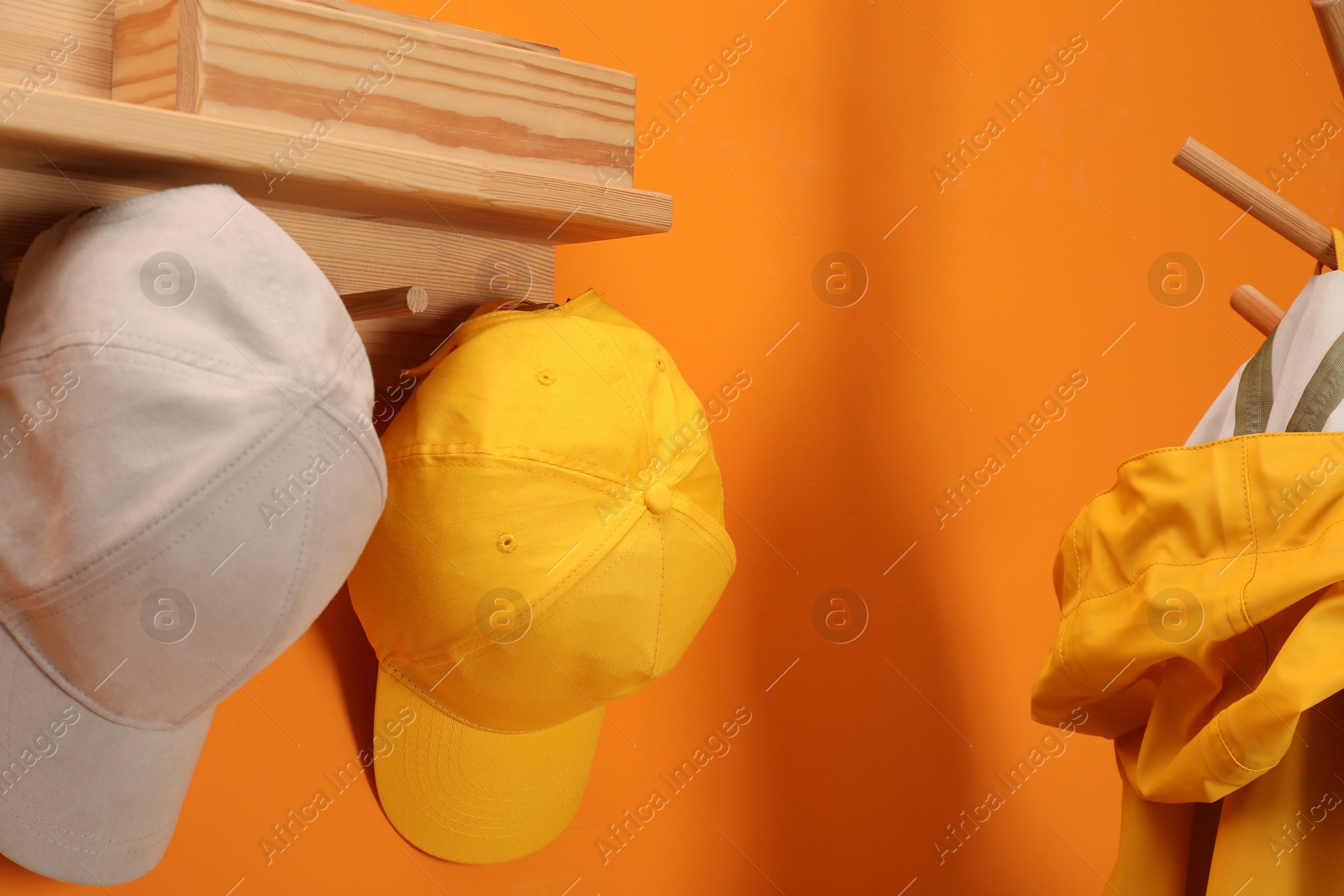 Photo of Stylish baseball caps indoors. Mockup for design