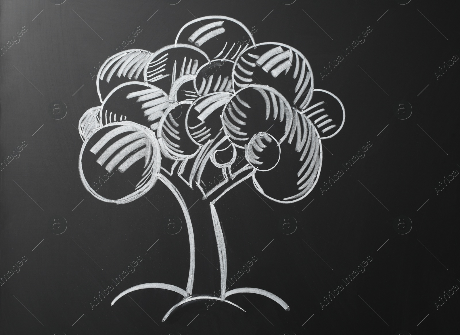 Photo of Beautiful drawing of tree on black chalkboard